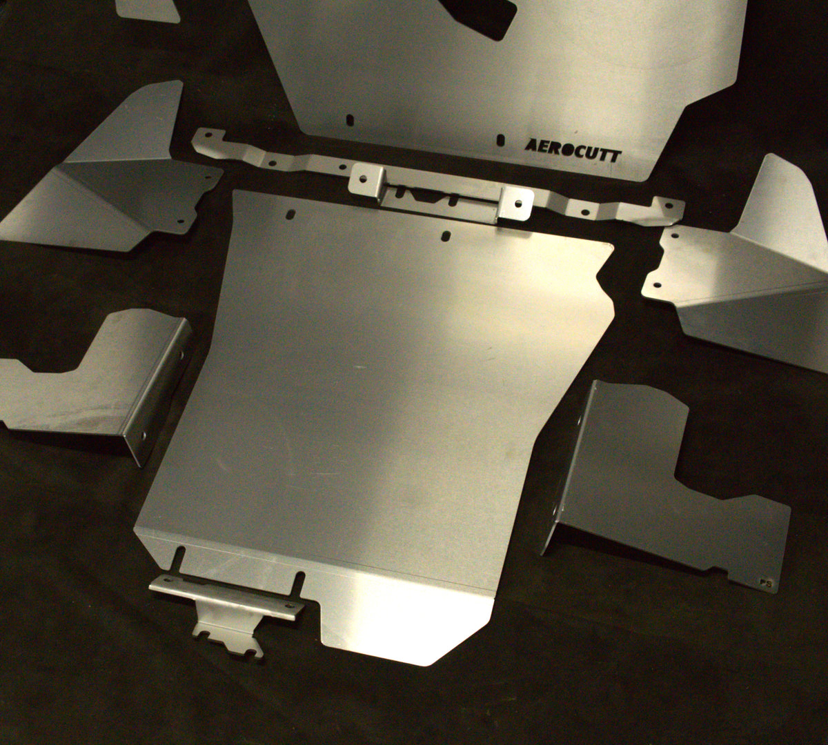 Aluminum underbody protection bash/skid plate for Subaru Impreza G3, displayed on a dark background.