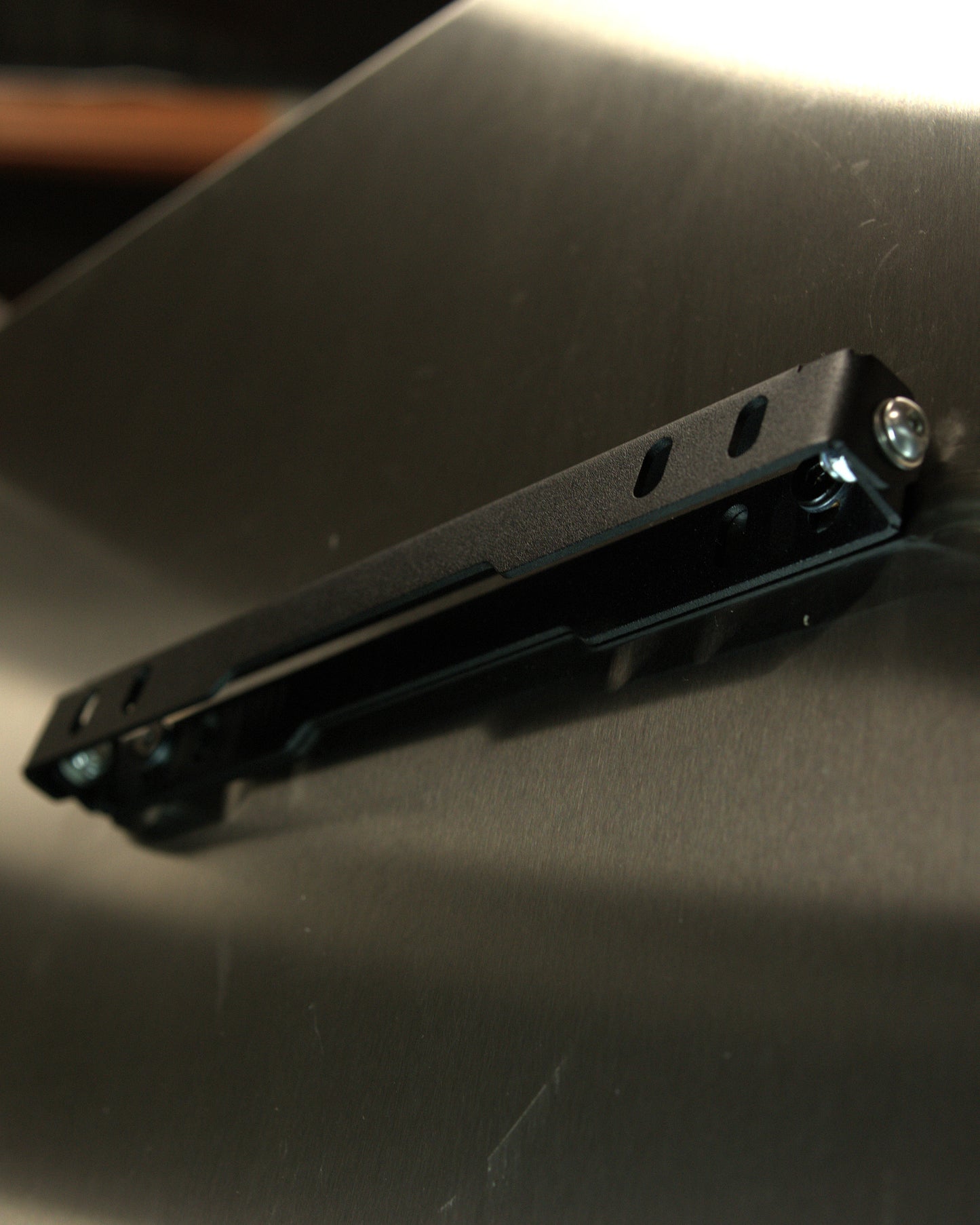 Aerocutt Low Profile Number Plate Tilt Down Bracket tilted up hide hidden angled plate holder