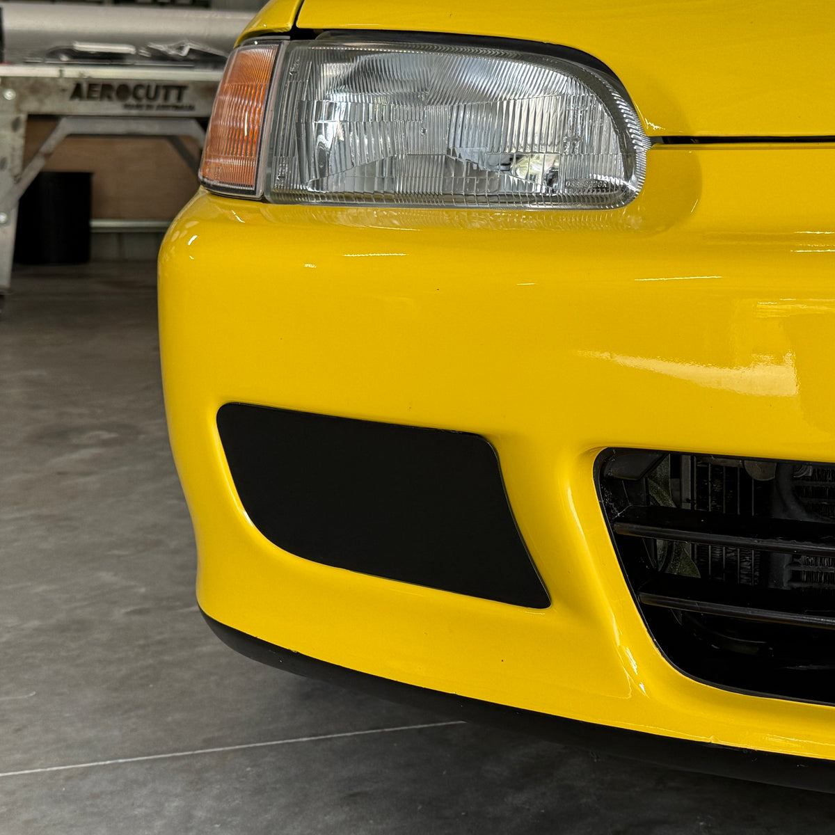 Honda Civic EG front with Aerocutt plastic fog light delete blank plates installed
