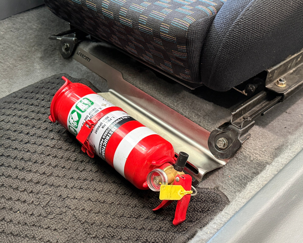 Honda Civic EG 5th Generation passenger side interior with an Aerocutt stainless steel fire extinguisher mount with a 1kg fire extinguisher securely mounted