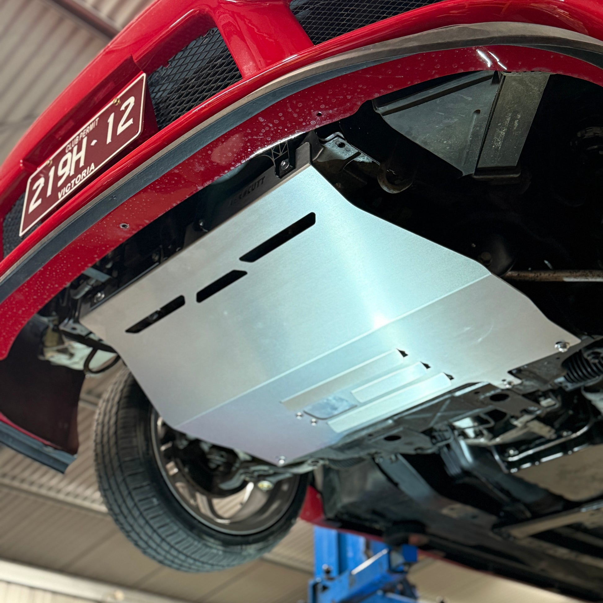 the underfloor of a nissan stagea c34 with a skid plate from aerocutt 