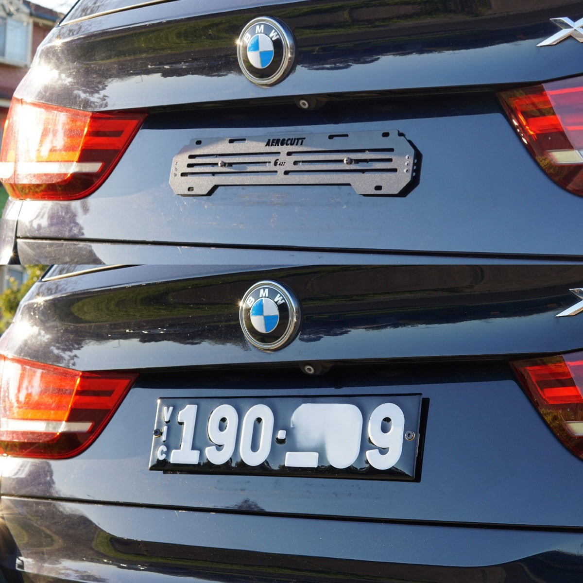 A close-up of the rear of a dark blue BMW car showing the license plate area, with a metallic license plate frame mounted on the car to mount the plate. The bracket has the brand name 'Aerocutt' printed on it.