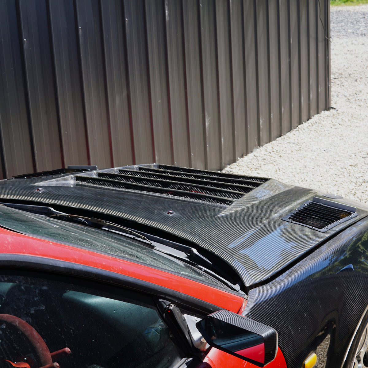 Carbon fibre bonnet on nissan skyline race car with aerocutt bonnet vents installed for cooling benefits