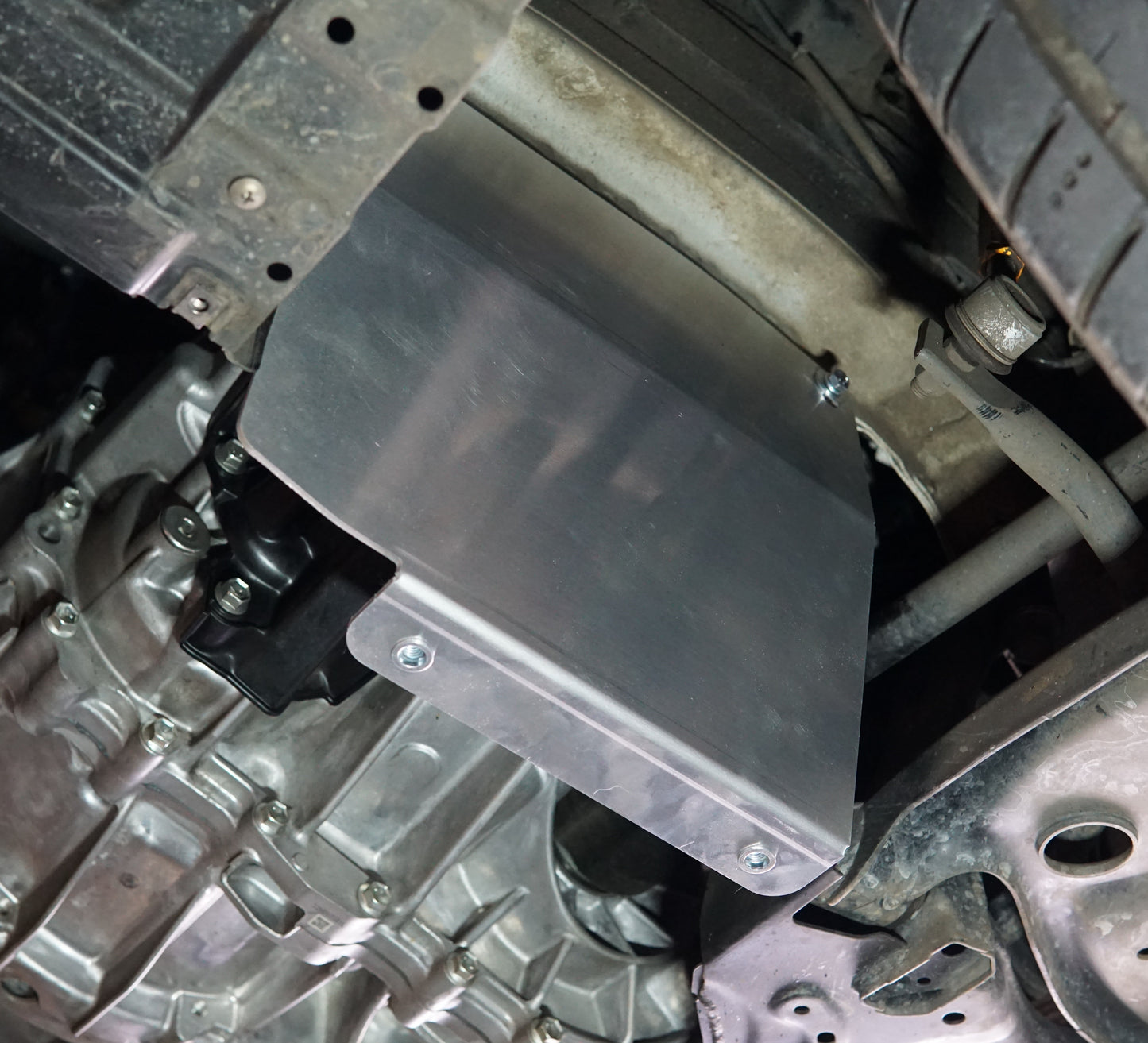 Suzuki Swift zc33 underside with metal skid plate side upright installed
