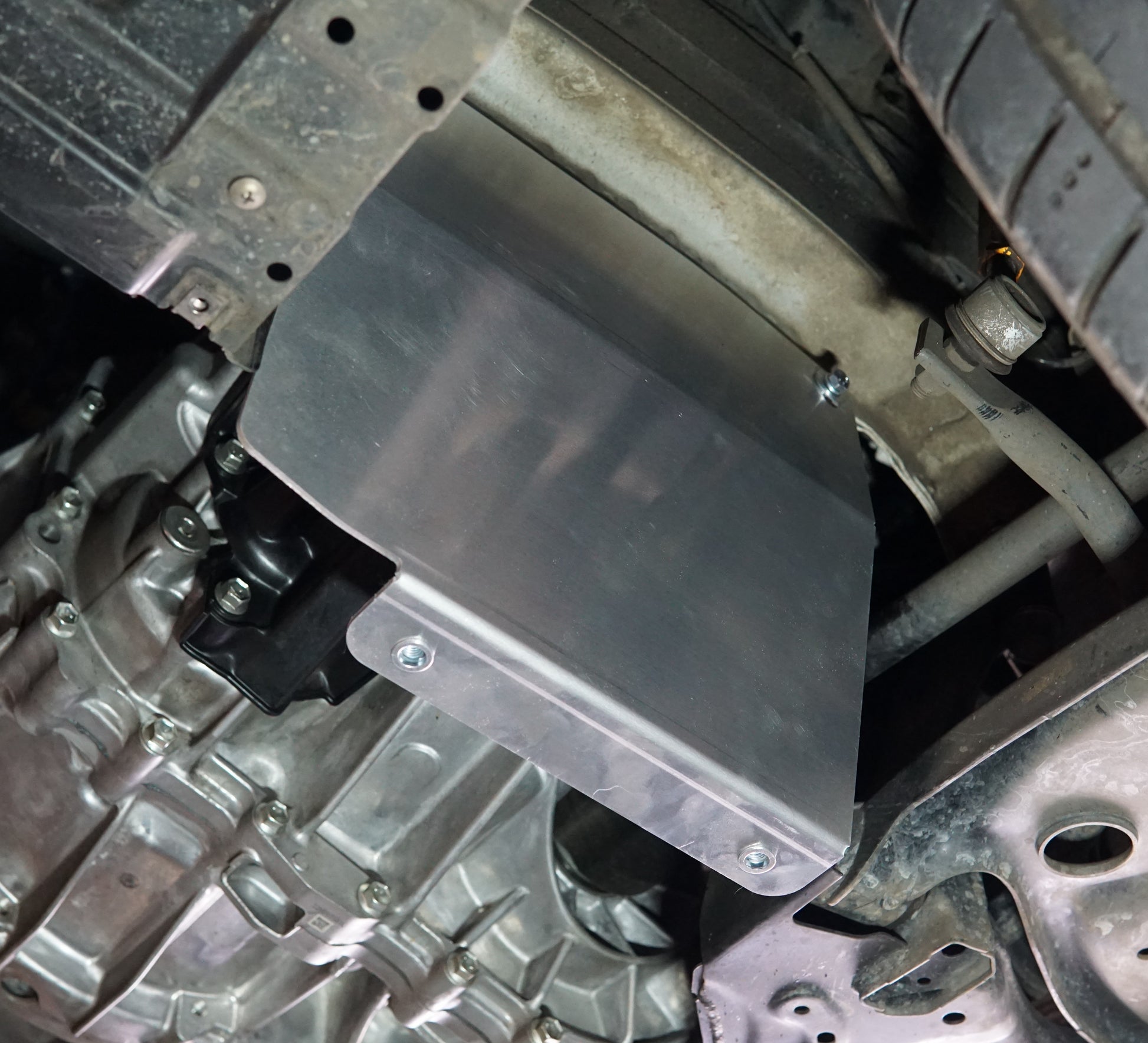 Suzuki Swift zc33 underside with metal skid plate side upright installed