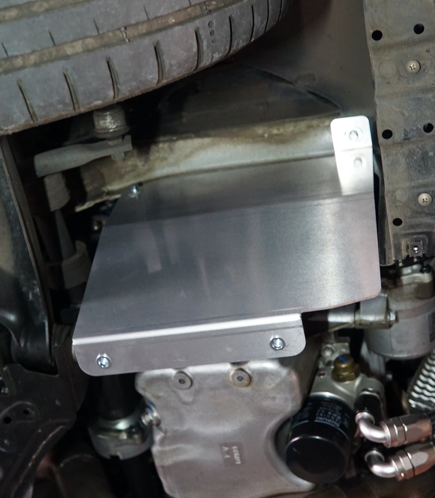Suzuki Swift zc33 underside with metal skid plate side support installed