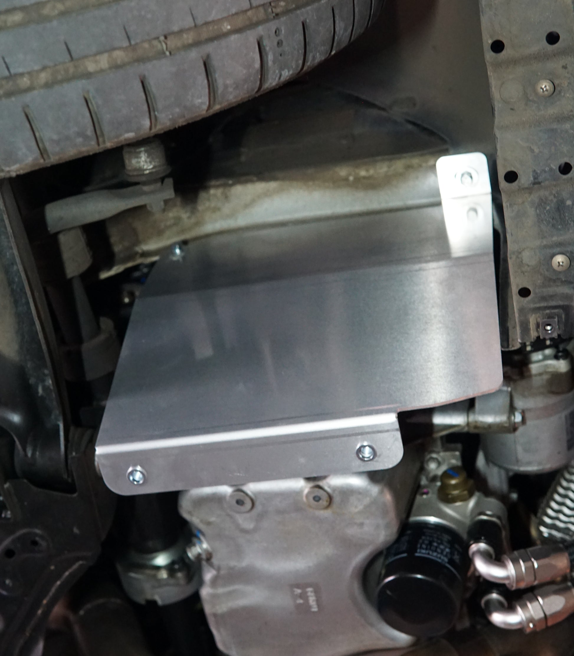 Suzuki Swift zc33 underside with metal skid plate side support installed