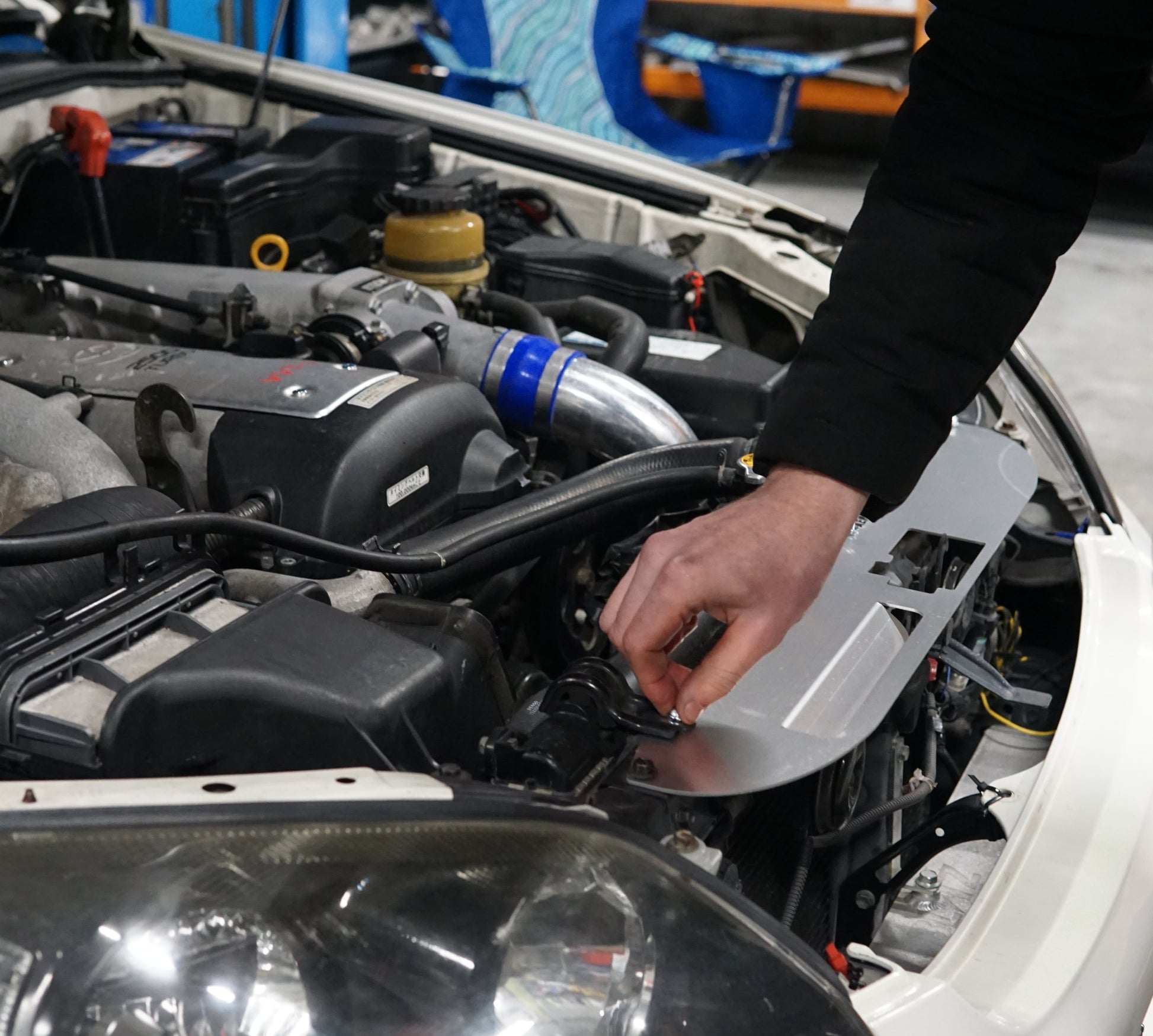 jzx110 toyota mark 2 with aerocutt engine bay cooling panel being installed