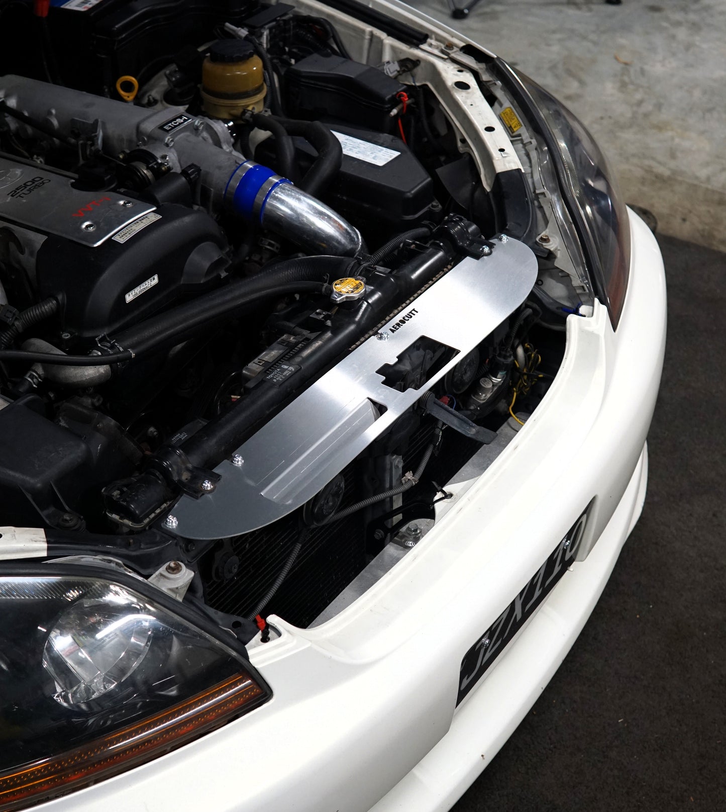 jzx110 toyota mk2 with aerocutt engine bay cooling panel installed