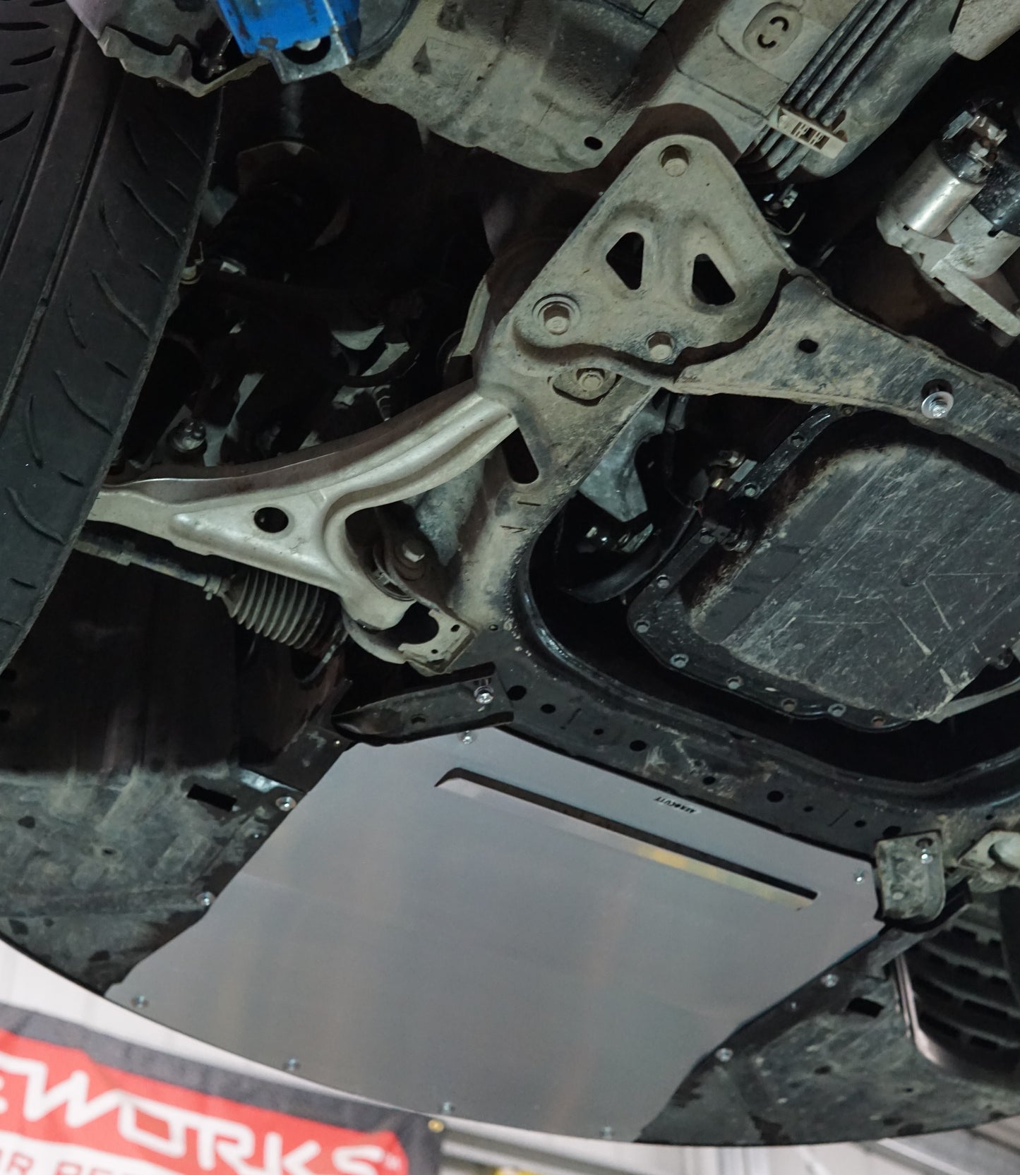 Mazda RX8 underside with Aerocutt front aero protection panel installed for cooling