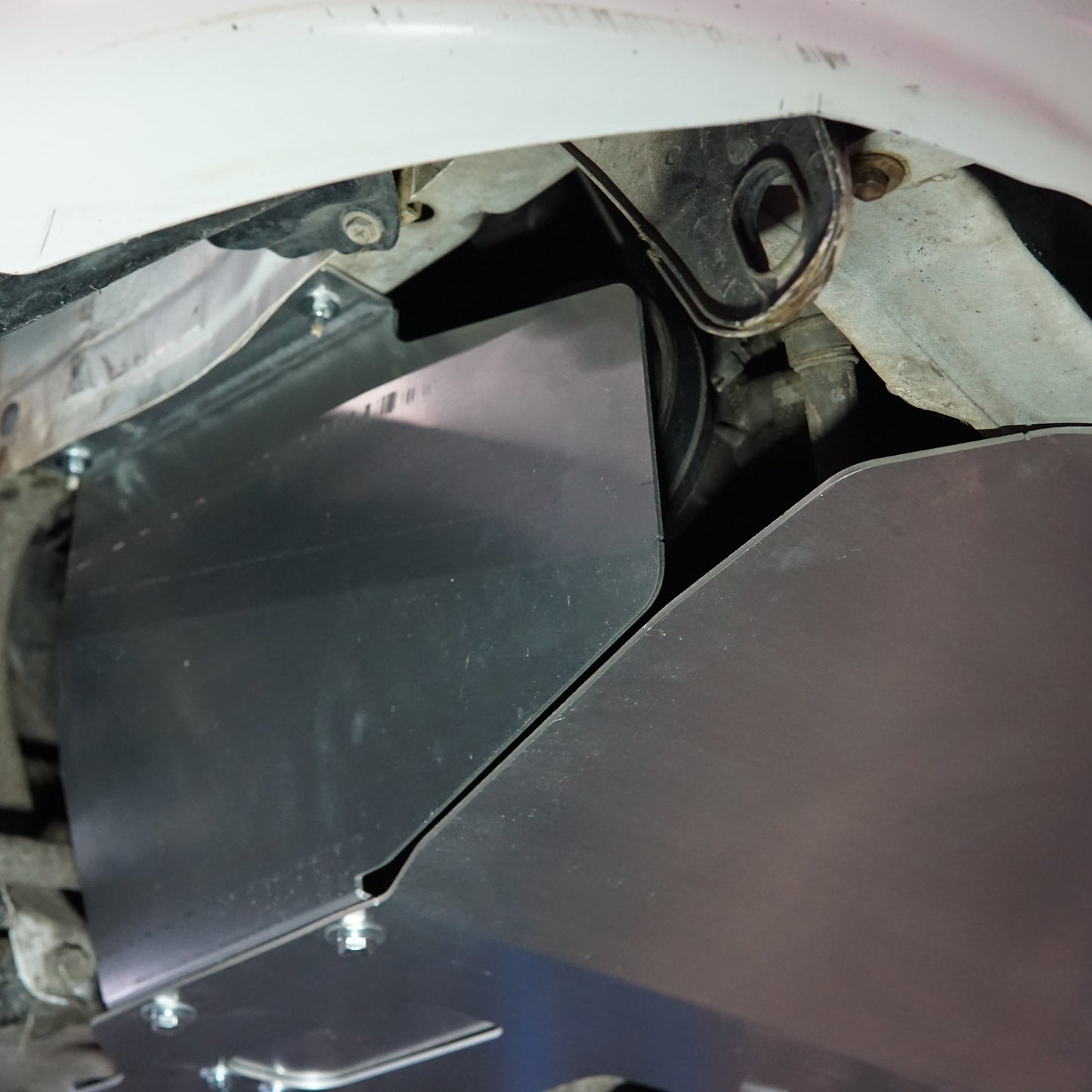 Toyota Starlet EP91 underside with an Aerocutt aluminium sump guard installed protecting the engine