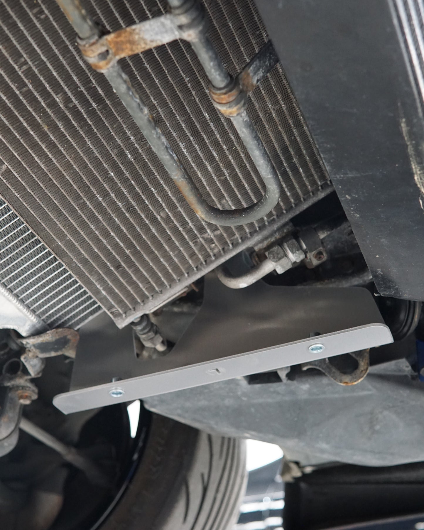 Mazda FD RX-7 Underbody with an Aerocutt aluminium front undertray support brace installed.