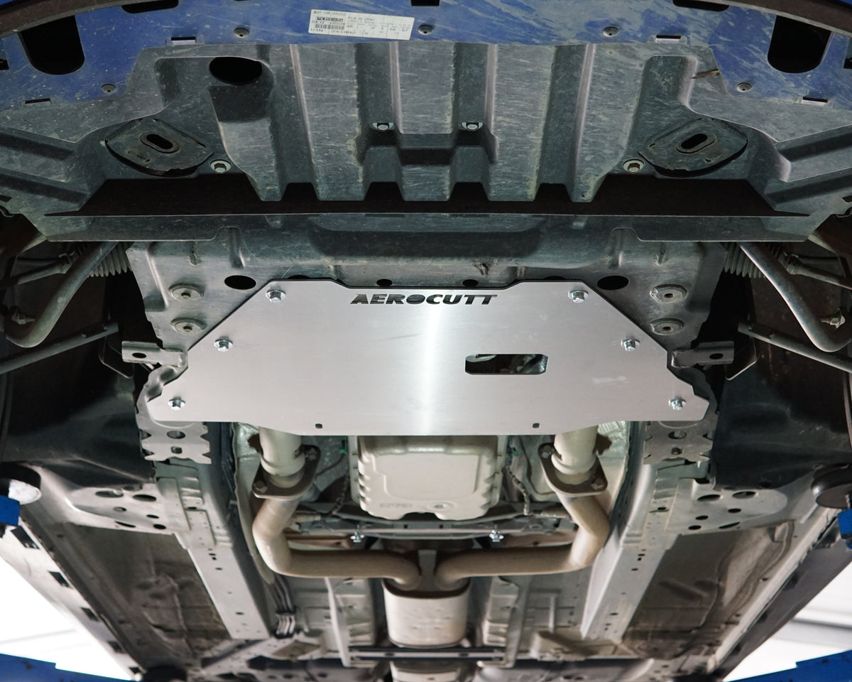 Holden VF Commodore on a lift showing the underside with an aerocutt heavy duty aluminium undertray engine protection plate