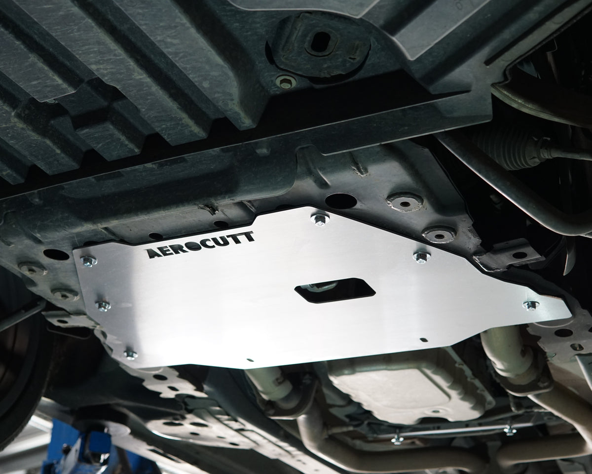 VE Commodore on a lift showing the underside with an aerocutt heavy duty aluminium undertray engine protection plate