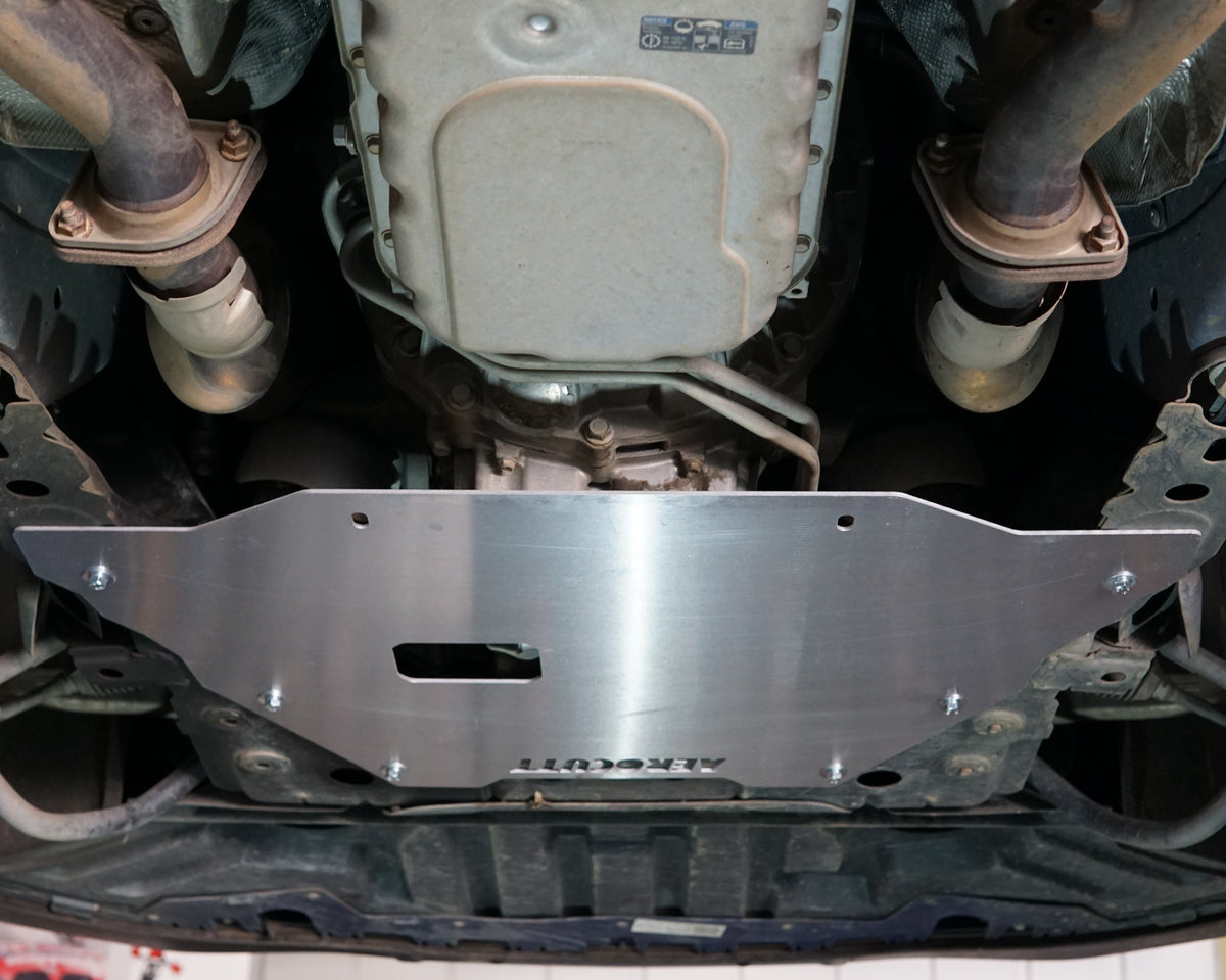 VF Commodore on a lift showing the underside showing an aerocutt heavy duty aluminium undertray engine protection plate