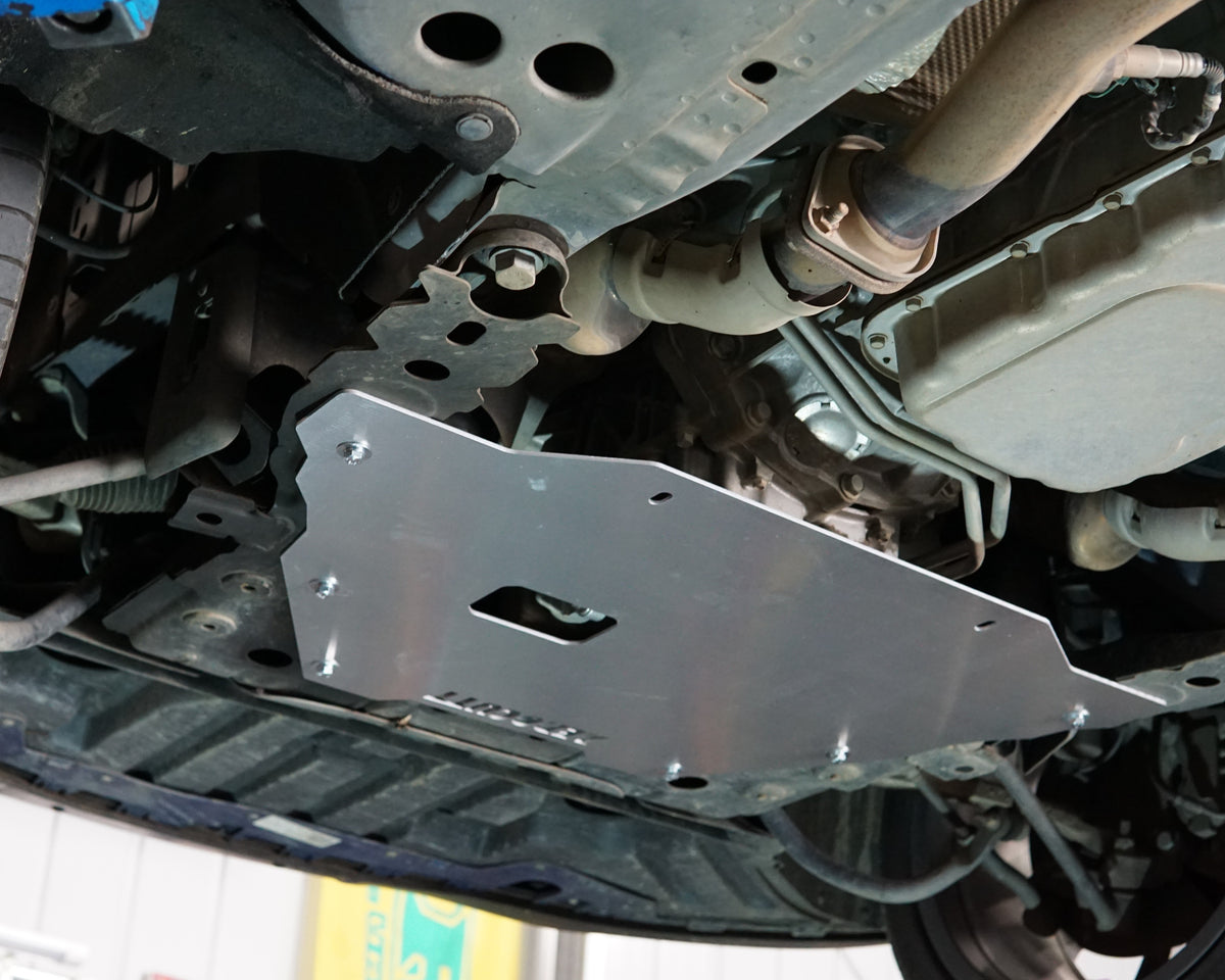 VE Commodore on a lift showing the underside showing an aerocutt heavy duty aluminium undertray engine protection plate