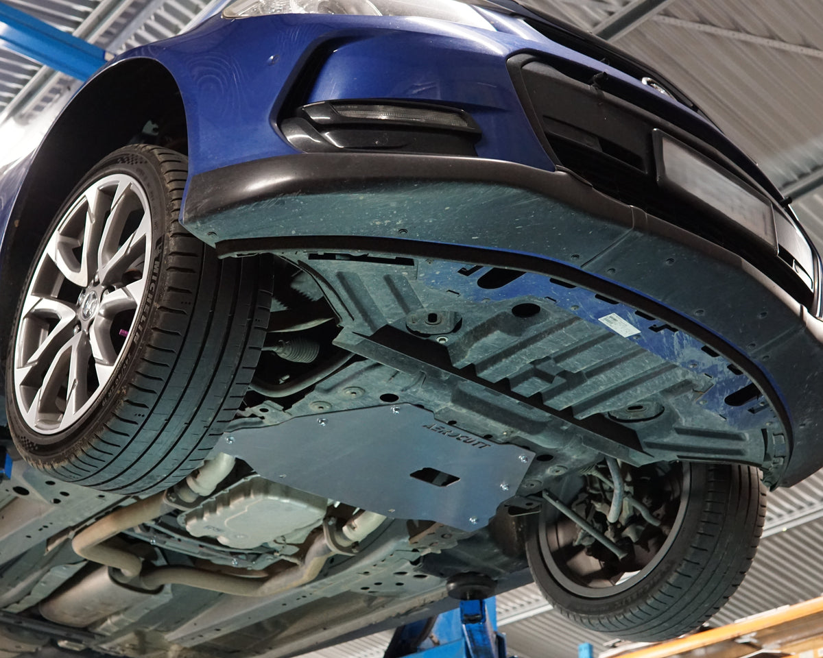 Holden VF Commodore on a lift showing the underside with an aerocutt heavy duty aluminium undertray