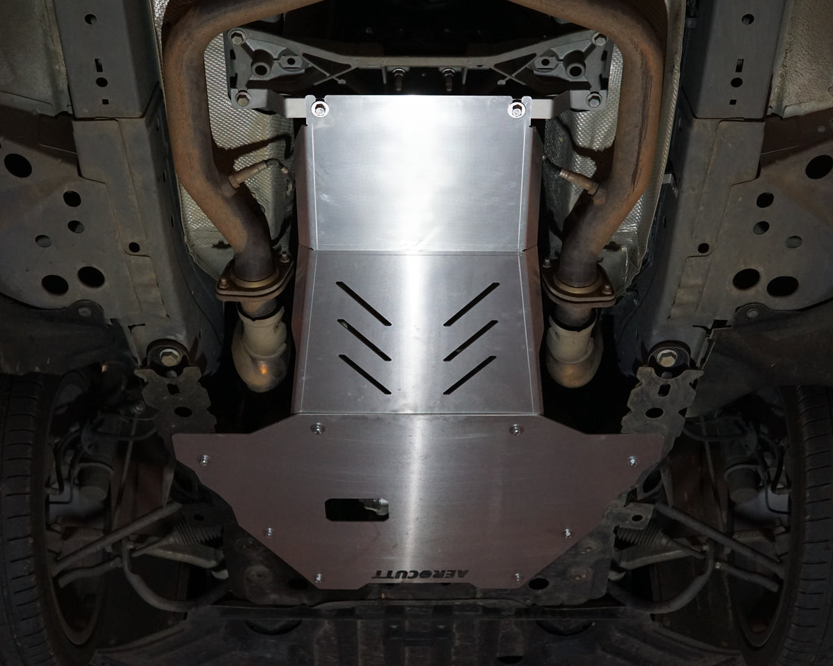 VF Commodore on a lift with an aerocutt heavy duty aluminium undertray set with transmission and engine protection plate installed