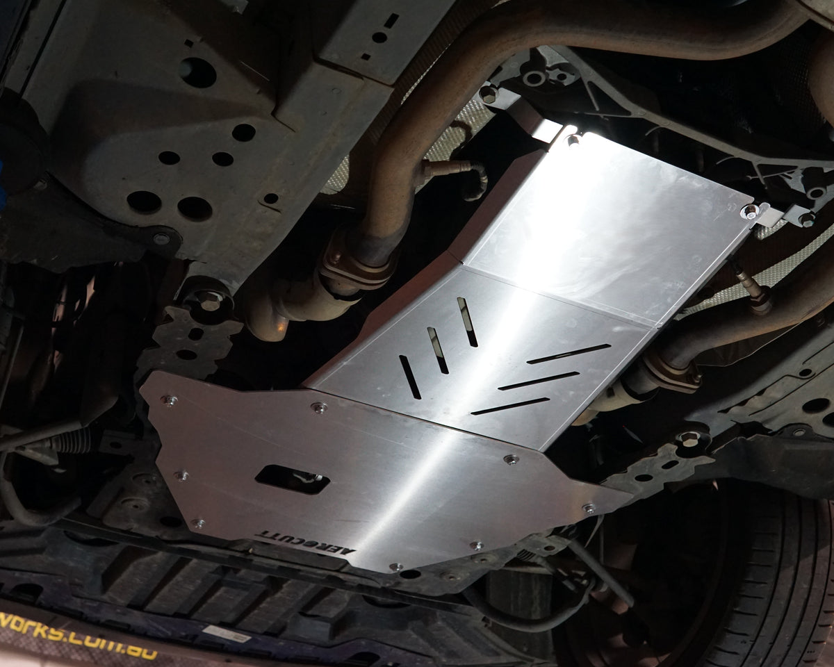 VE Commodore on a lift with an aerocutt heavy duty aluminium undertray set with transmission and engine protection plate installed