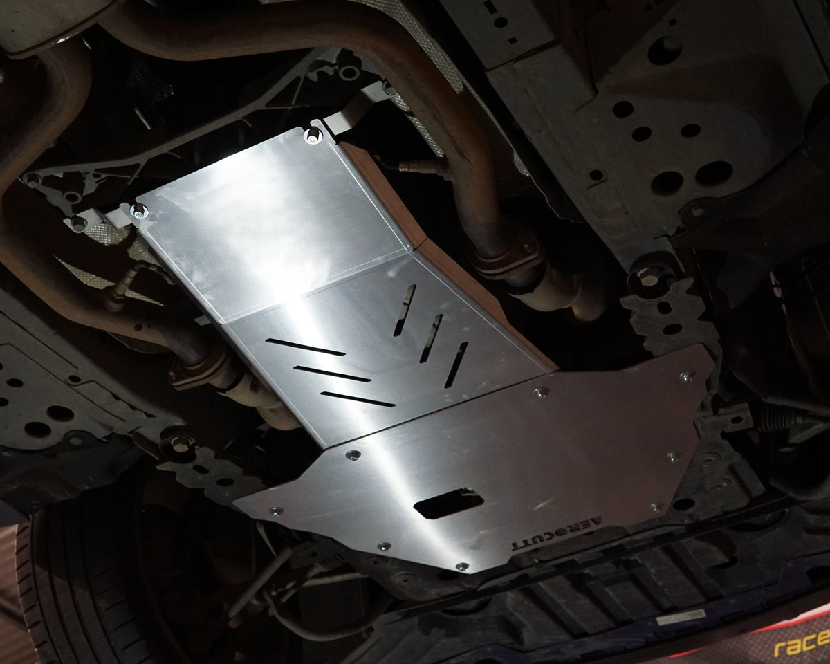 VF Commodore on a lift showing the underside with an aerocutt heavy duty aluminium undertray set with transmission and engine protection plate installed