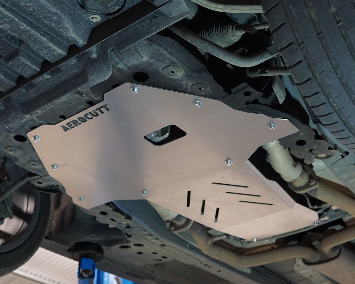 VF Commodore Underneath on a lift with an aerocutt heavy duty aluminium undertray set with transmission and engine protection plate installed