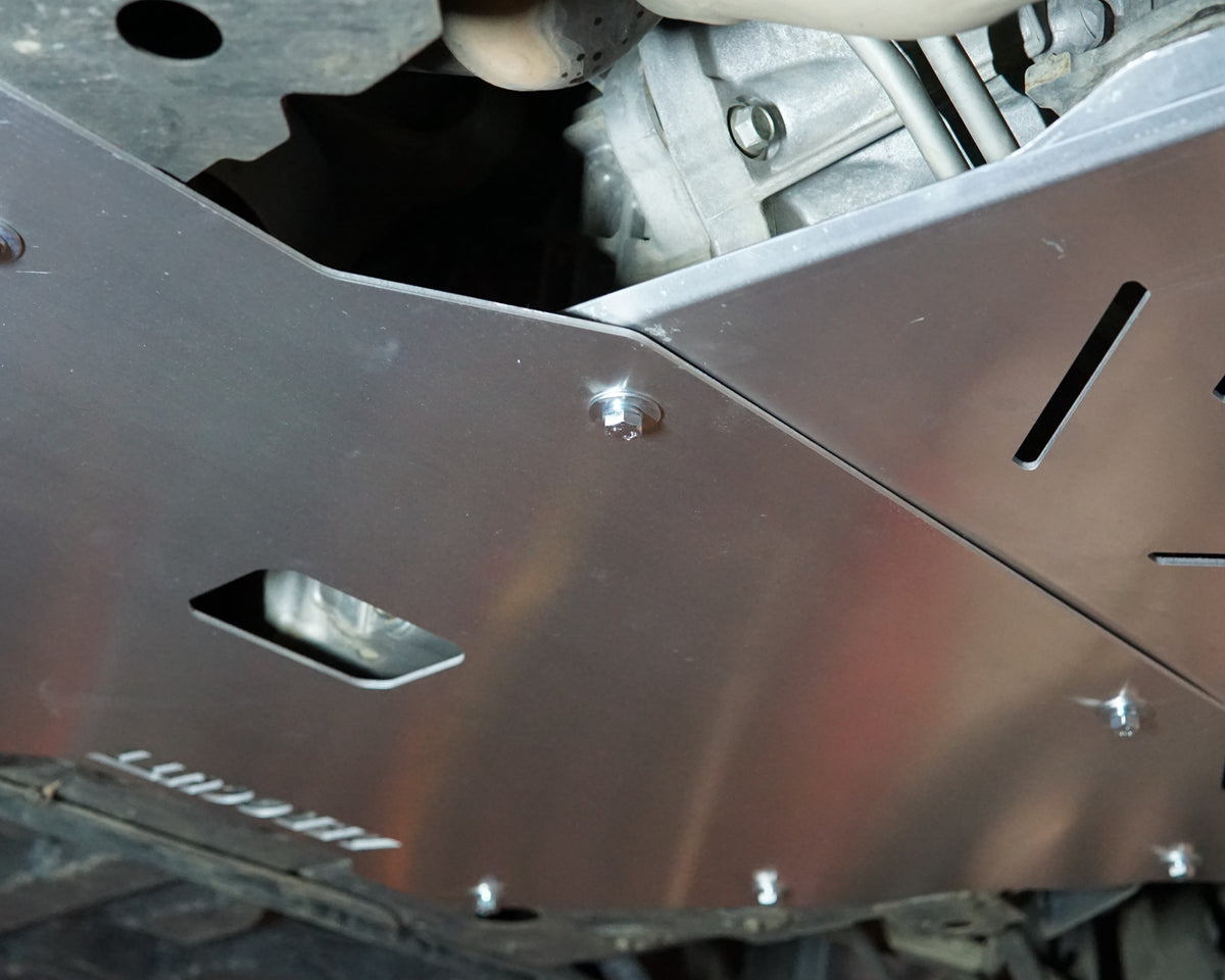 VE Commodore on a lift showing the underside with an aerocutt heavy duty aluminium undertray set with transmission and engine protection plate installed