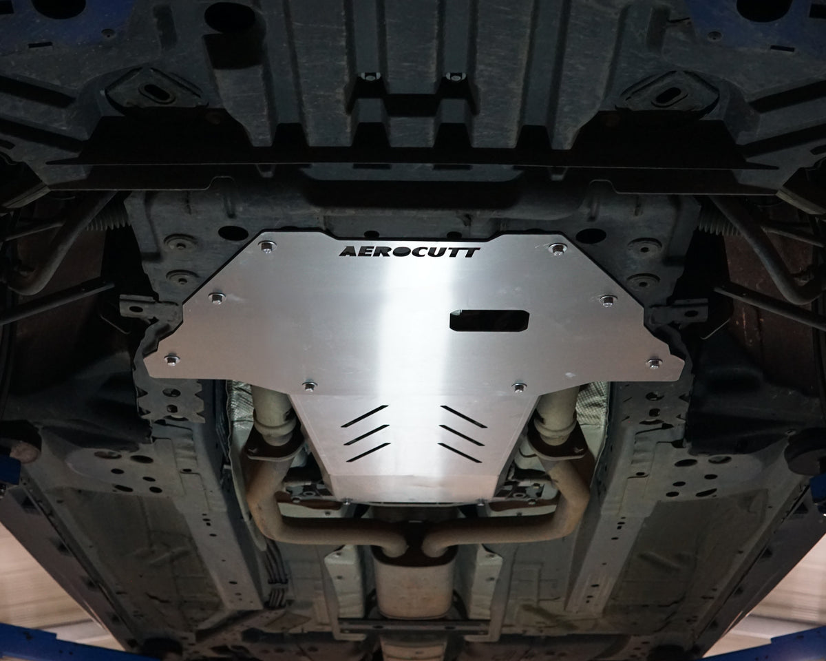 VE Commodore Underneath on a lift with an aerocutt heavy duty aluminium undertray set with transmission and engine protection plate installed