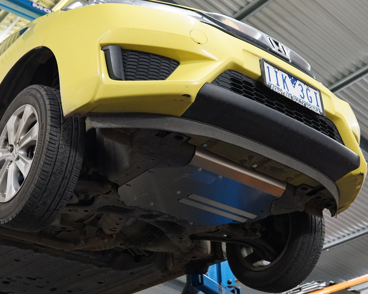 A yellow Honda GK Jazz Underbody With an Aerocutt aluminium undertray replacement fitted