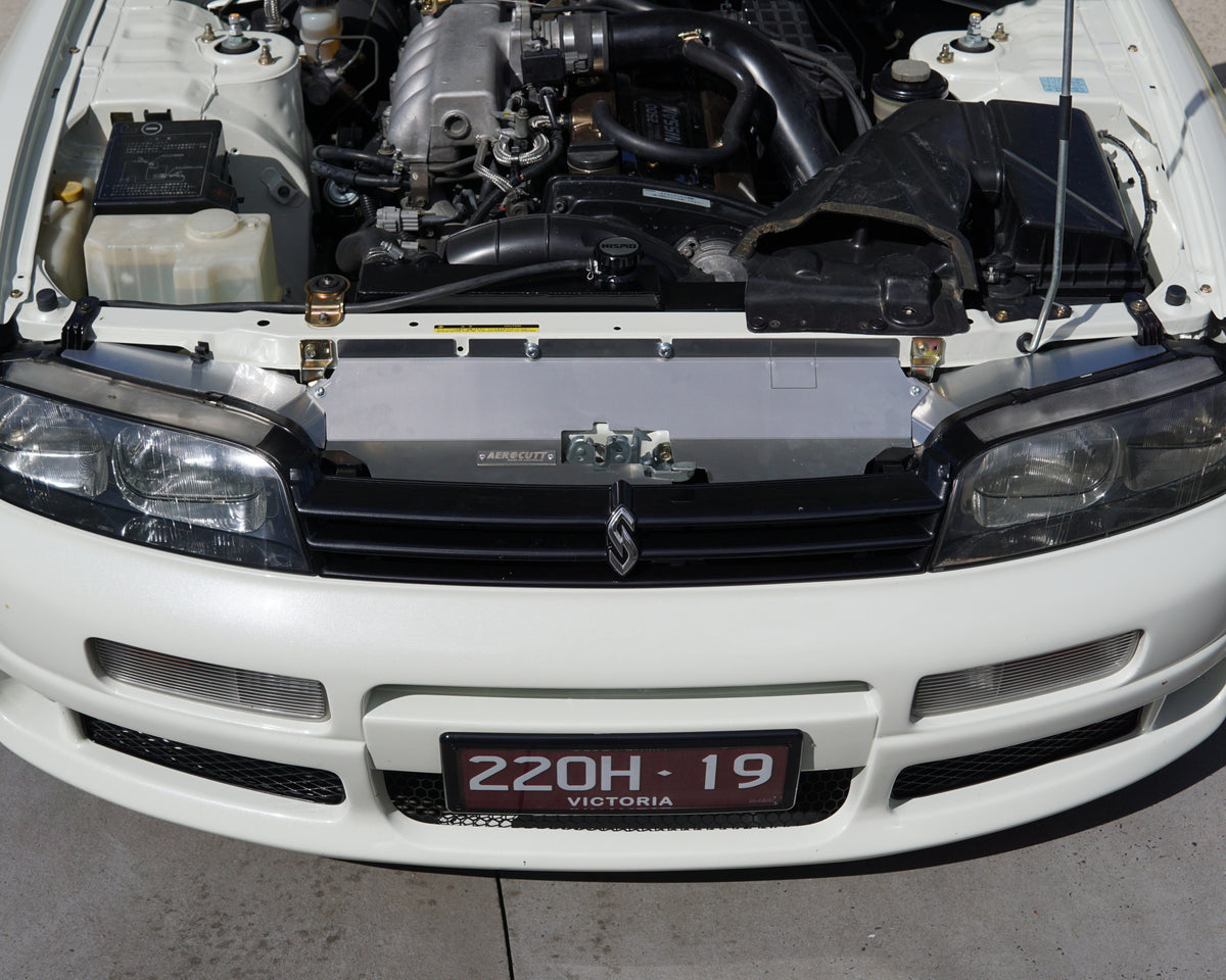Nissan Skyline R33 Series 1 Gts-t front engine bay area with an Aerocutt aluminium dress up parts installed