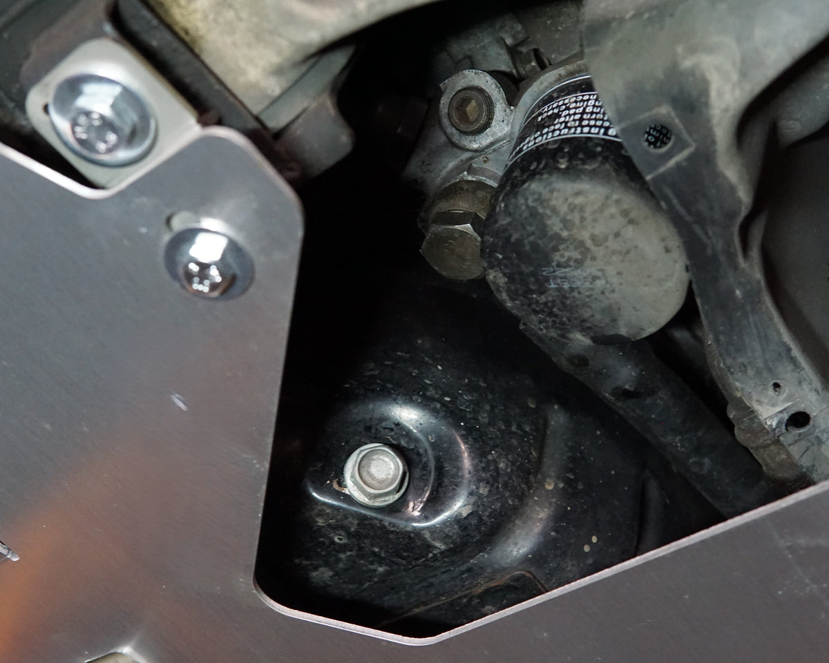 Mitsubishi Evolution 8 VIII front undercarriage with Aerocutt aluminium vented skid plate installed showing cutouts for servicing the car