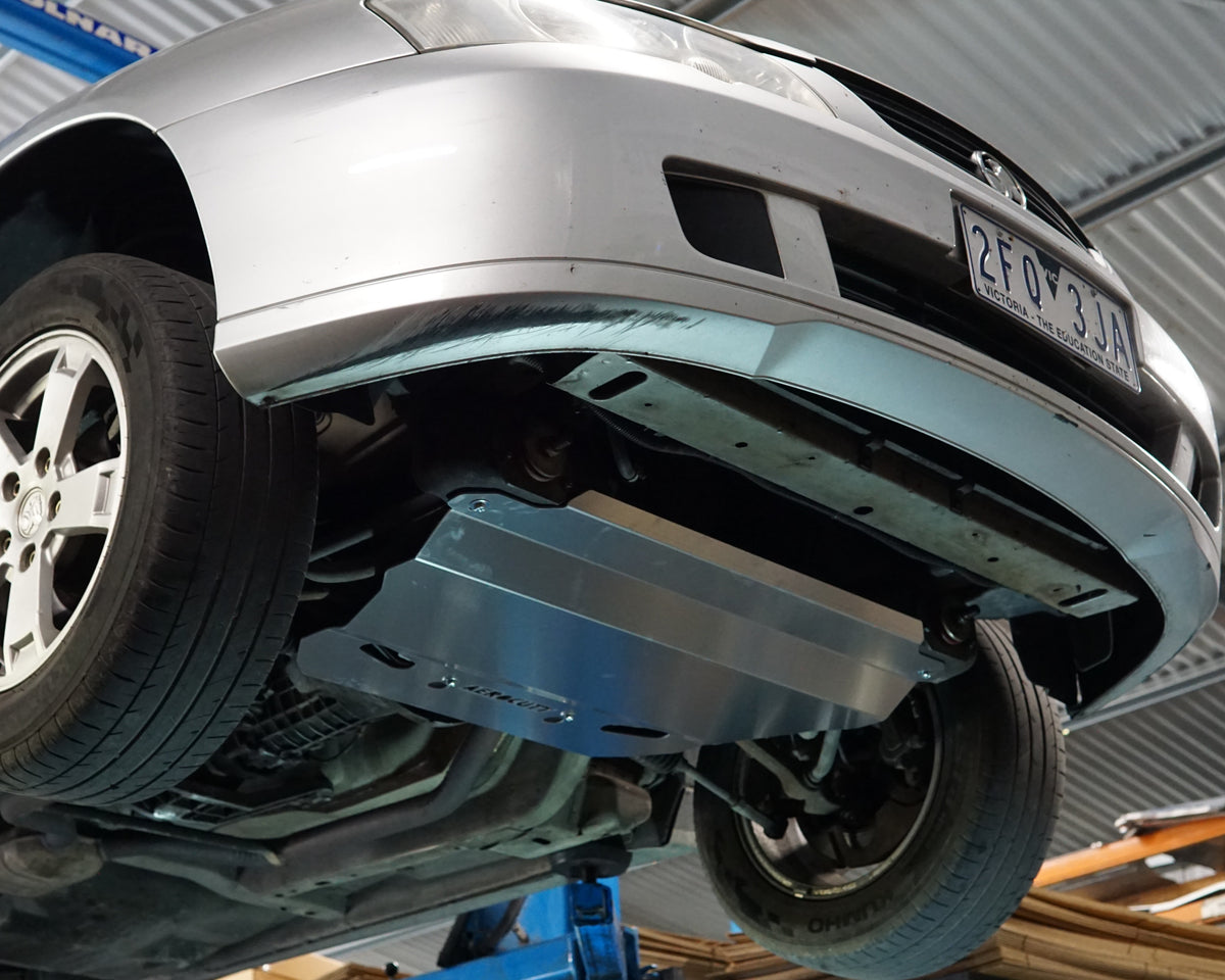 Holden Commodore VY front undercarriage with an Aerocutt steel heavy duty skid plate installed on the underside of the car