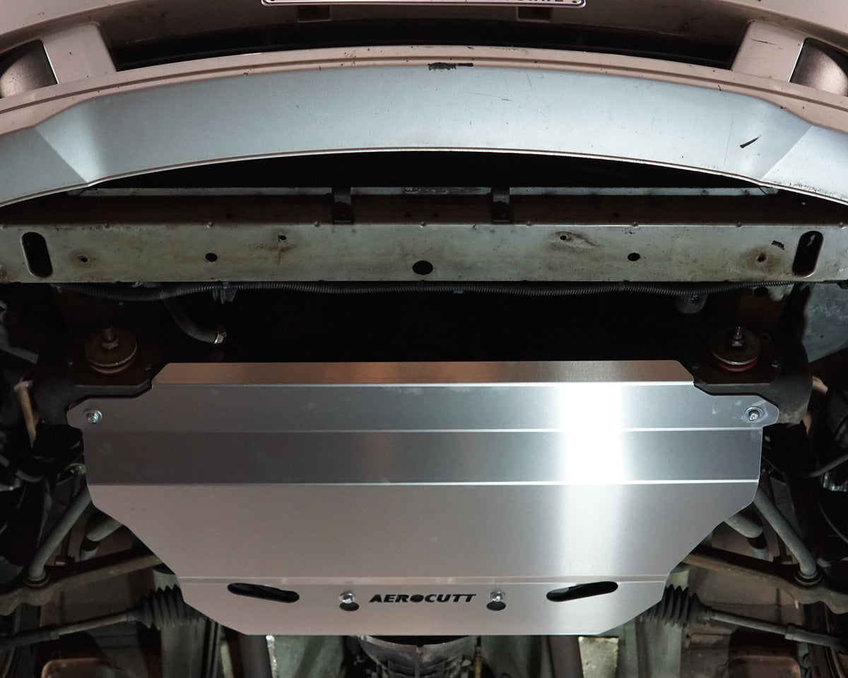 Holden Commodore VX front undercarriage with an Aerocutt steel heavy duty skid plate installed on the underside of the car