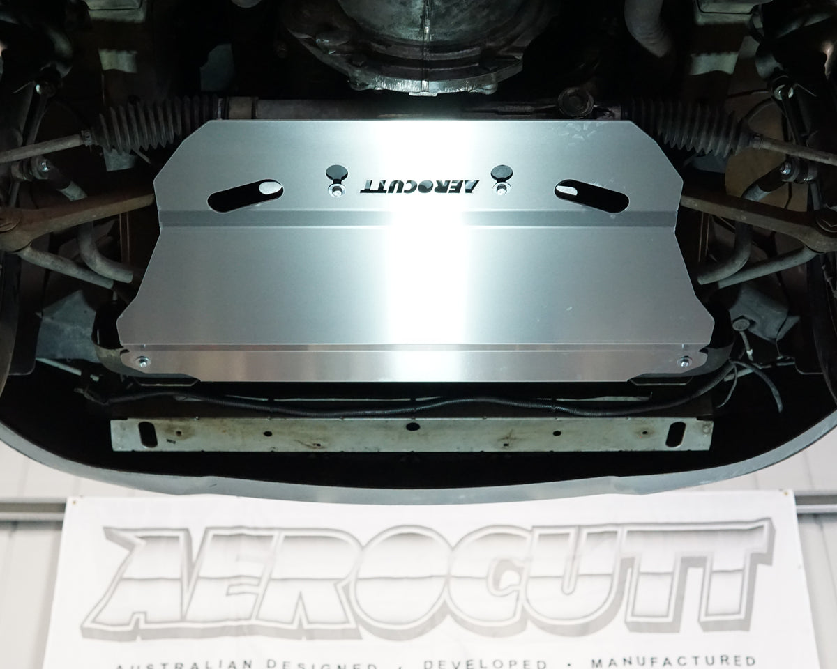 Holden Commodore VX front undercarriage with an Aerocutt aluminium heavy duty skid plate installed on the underside of the car