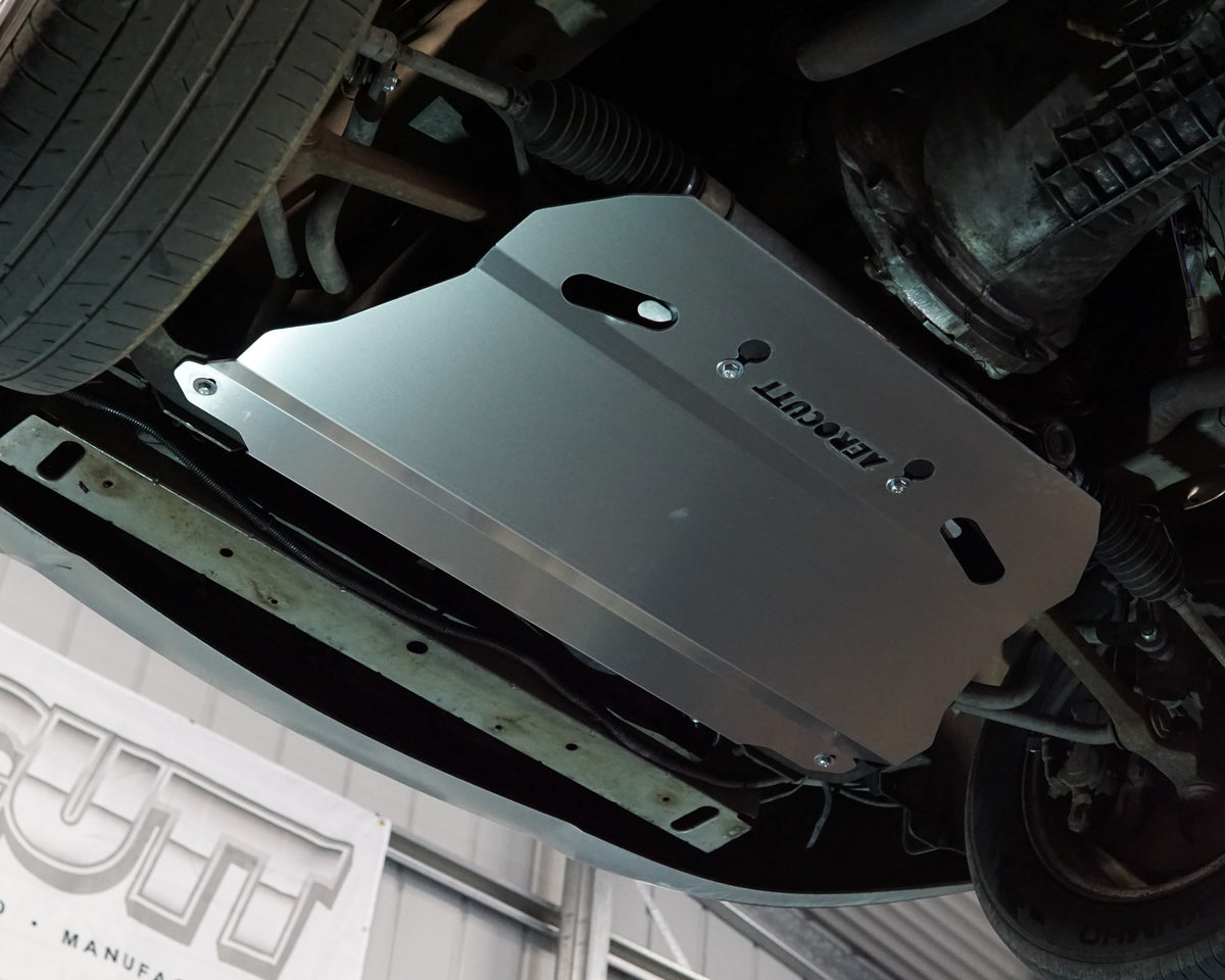Holden Commodore VZ front undercarriage with an Aerocutt aluminium heavy duty skid plate installed on the underside of the car