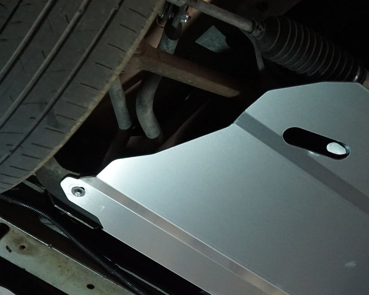 Holden Commodore VZ front undercarriage with an Aerocutt steel heavy duty skid plate installed on the underside of the car
