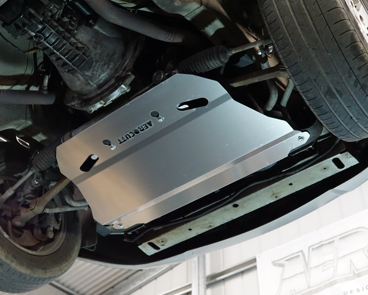 Holden Commodore VZ front undercarriage with an Aerocutt aluminium heavy duty bash plate installed underneath the car