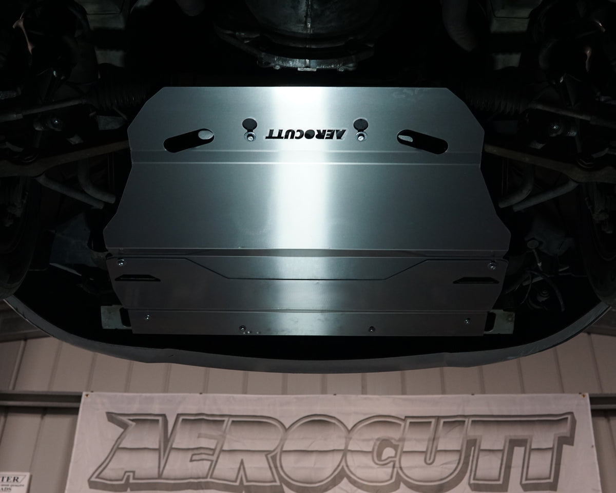 Holden Commodore VT front undercarriage with an Aerocutt aluminium heavy duty skid plate installed on the underside of the car