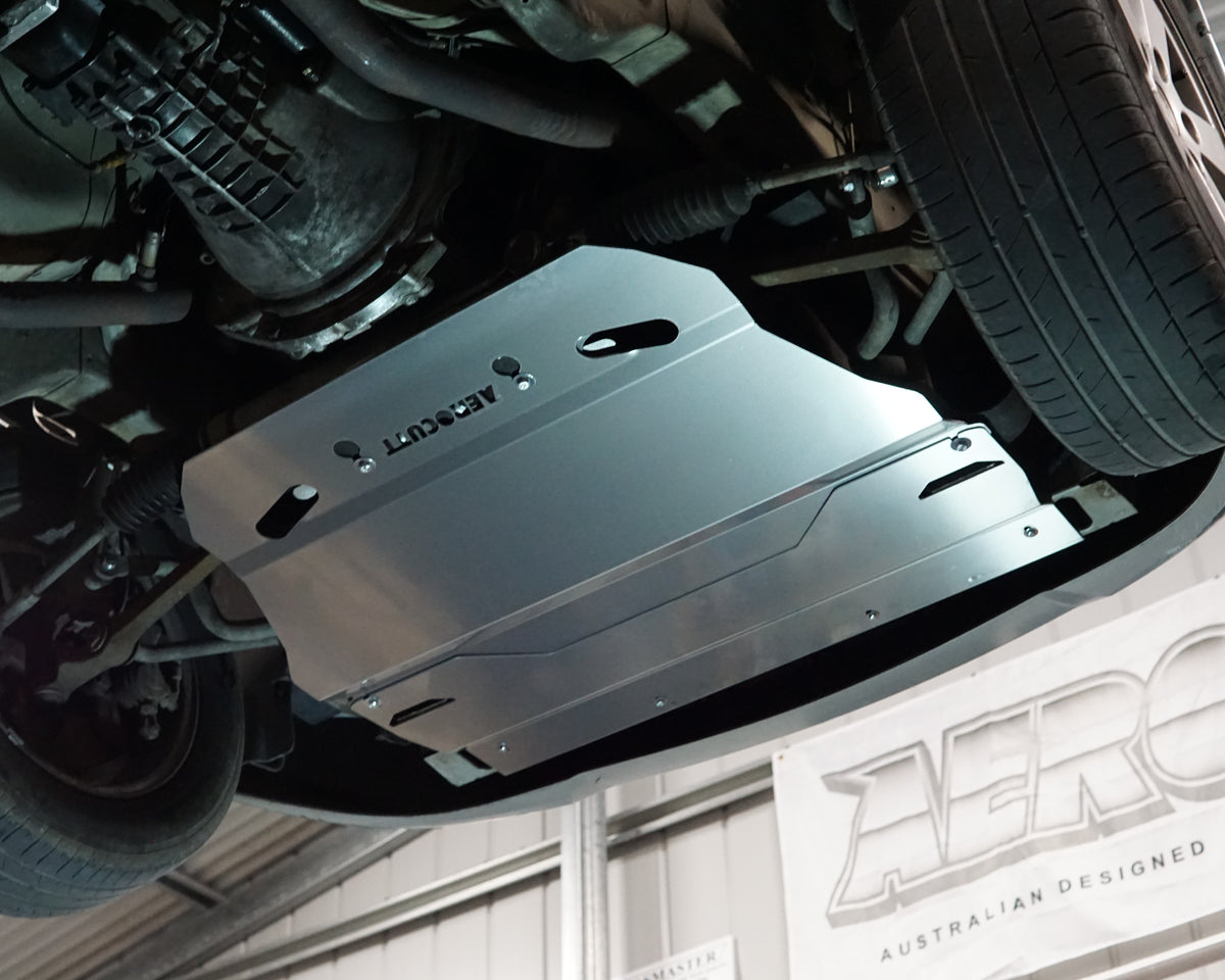 Holden Commodore VY front undercarriage with an Aerocutt aluminium heavy duty bash plate installed underneath the car