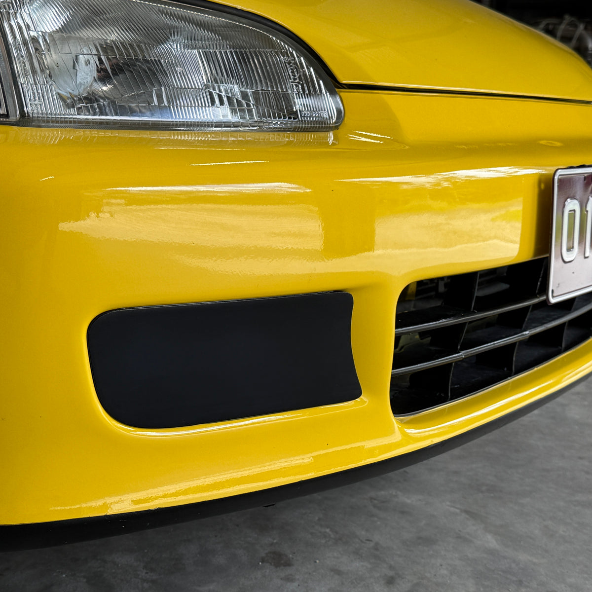 Honda Civic EG front with Aerocutt plastic fog light delete blank plates installed