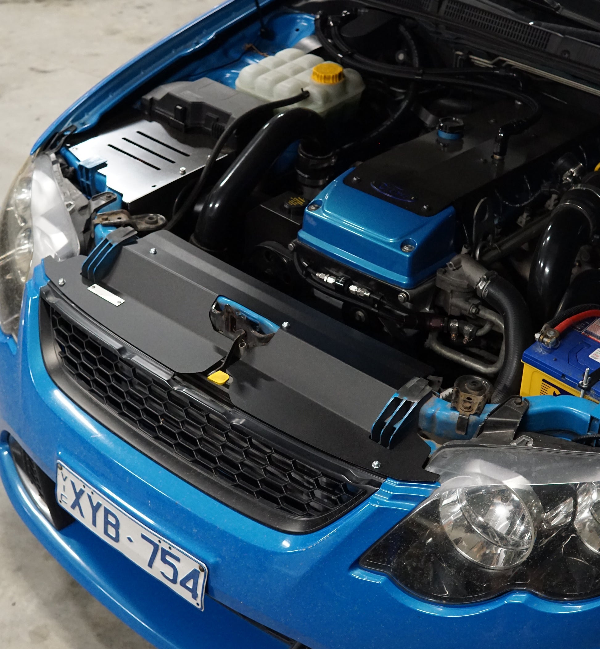 FG Ford falcon engine bay with cheap and easy aesthetic upgrade cooling panel 
