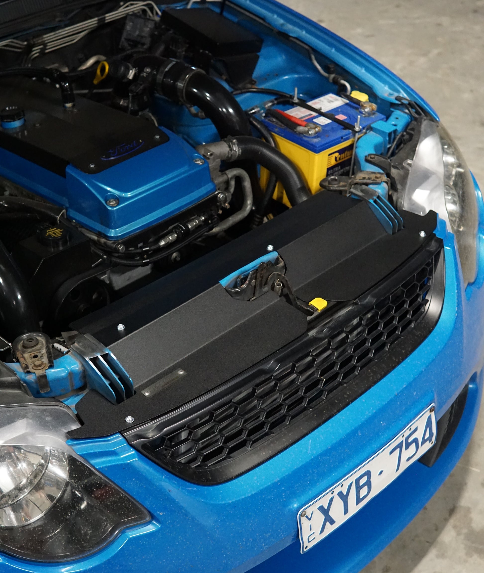 FG Ford falcon engine bay with bonnet open showing cooling panel fitted
