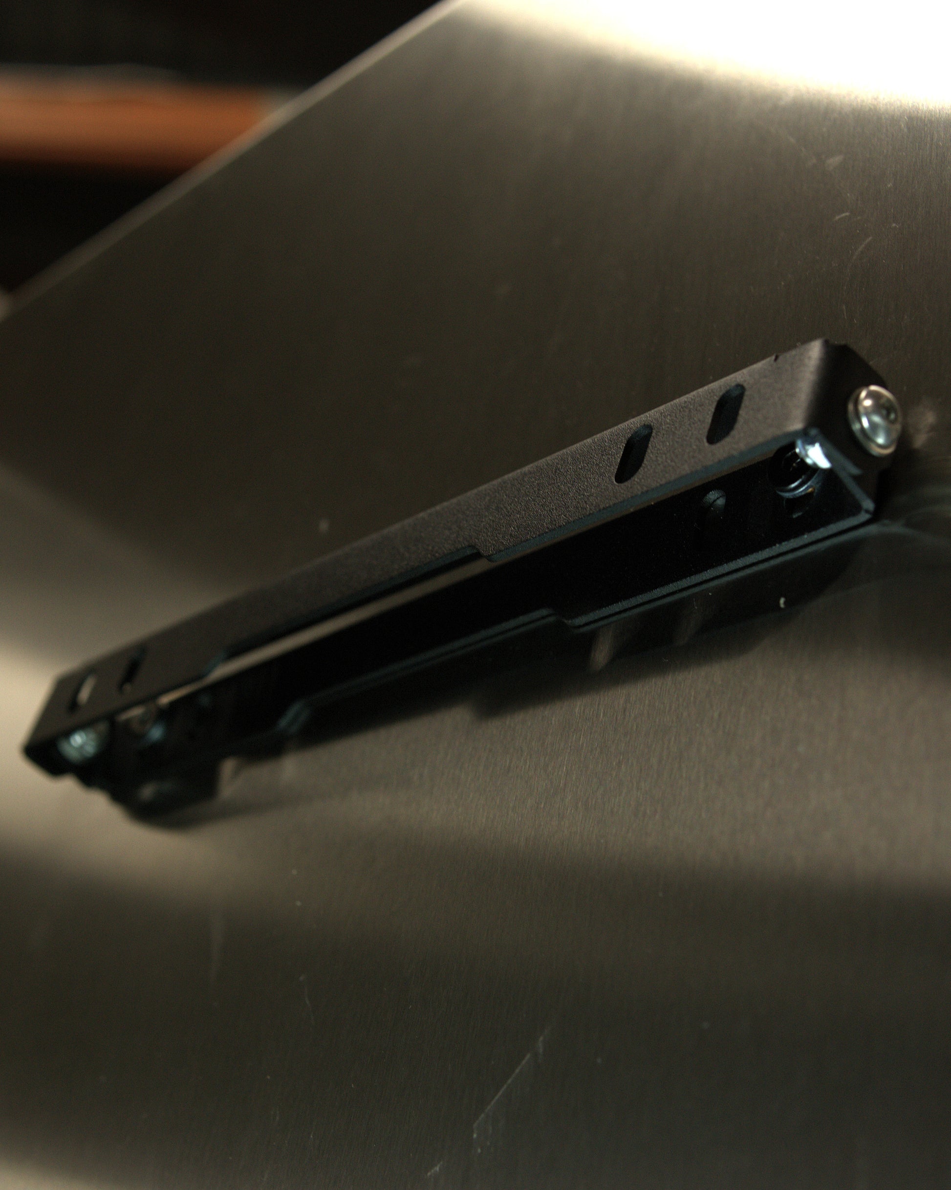 Aerocutt Low Profile Number Plate Tilt Down Bracket tilted up  hide hidden angled plate holder