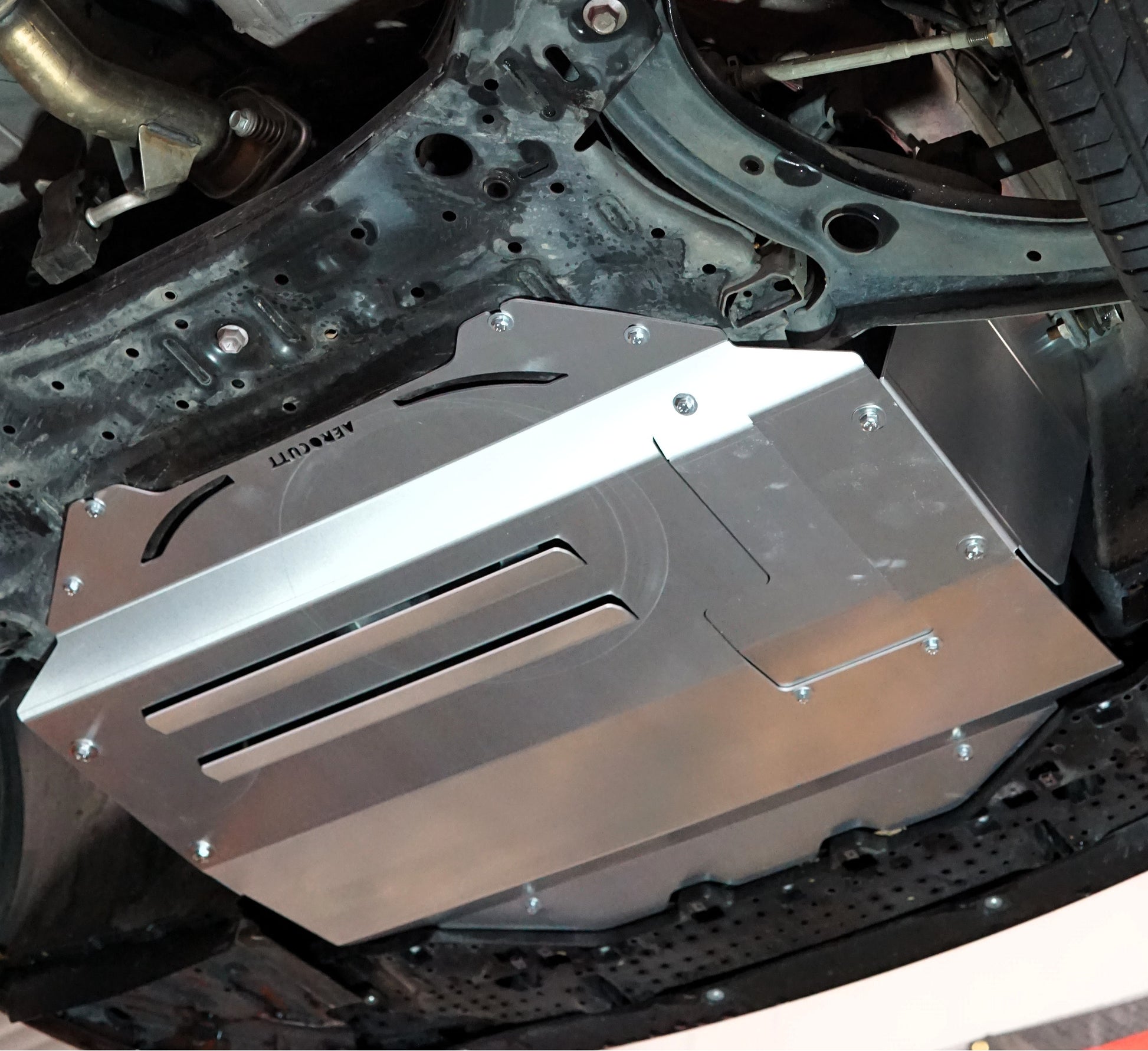 Suzuki Swift zc33 underneath with metal sump guard installed