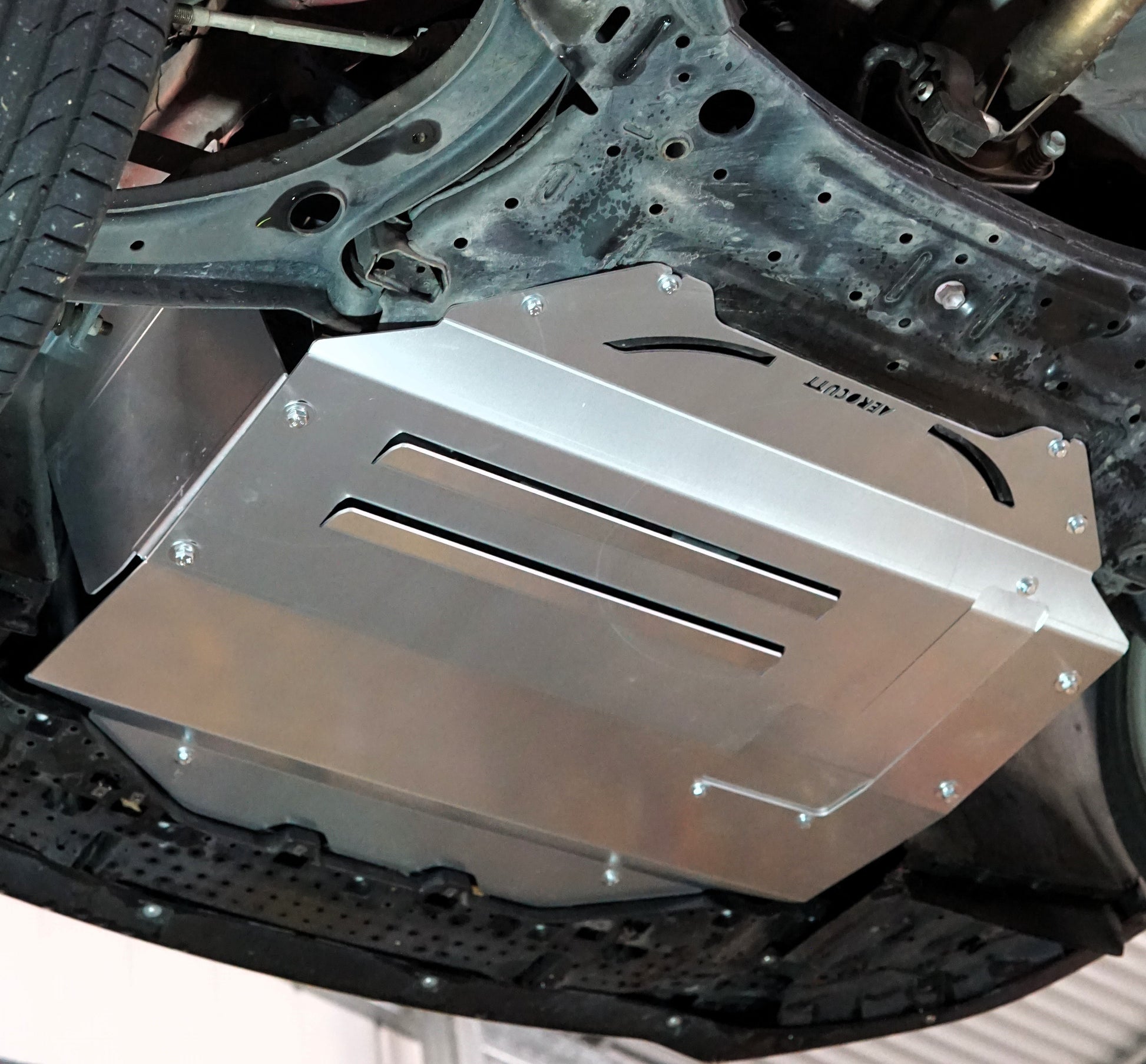 Suzuki Swift zc33 underneath with metal skid plate installed
